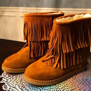 Genuine suede fringe ankle bootie.